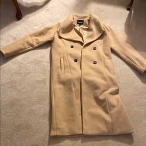 Tan Trench Coat with Notched Lapel and Structured Shoulders